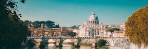 Rome, Italy. Papal Basilica Of St. Peter In The Vatican. Sightseeing Boat Floating Near Aelian Bridge. Tour Touristic Boat